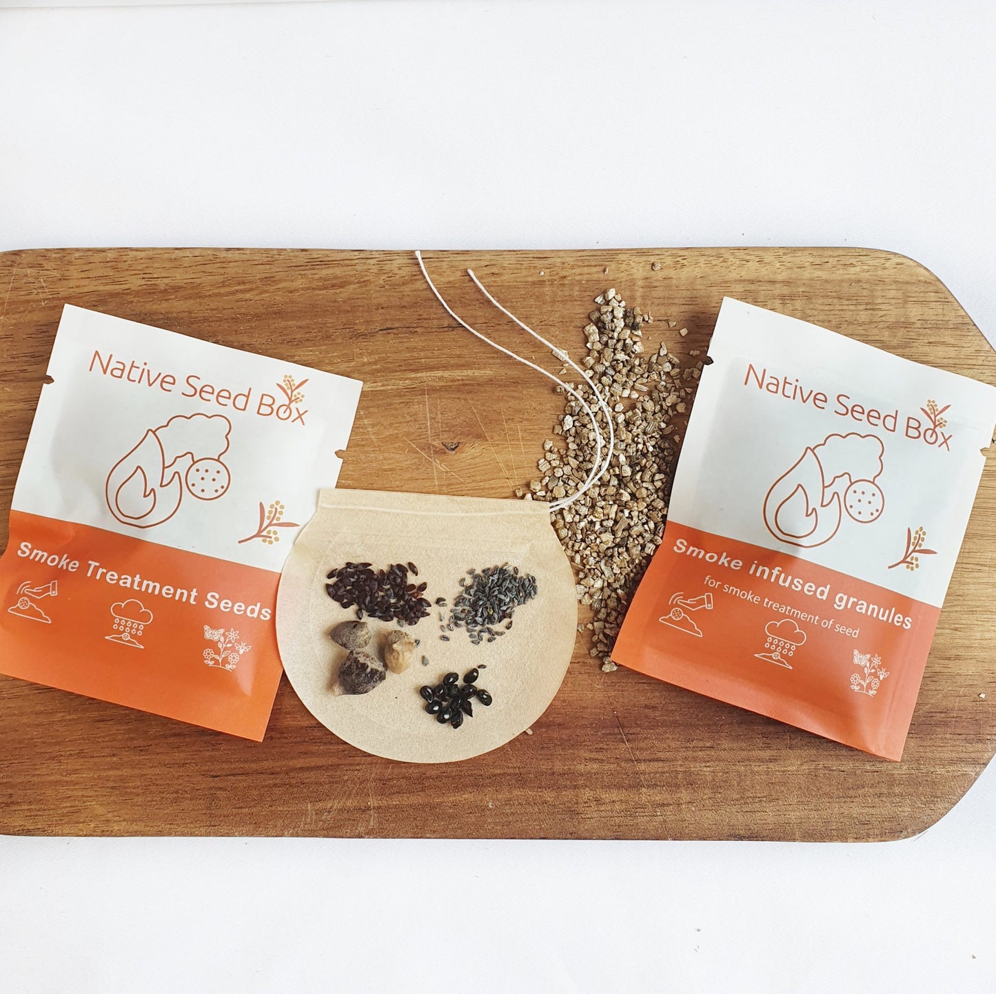 Contents of Native Seed Box Australian Bushfire Collection including seed bombs, smoke treatment seeds, and granules - ideal for eco-friendly gardening and supporting native plant growth with smoke treatment.