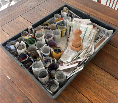 Tray of pots made from the paper pot press